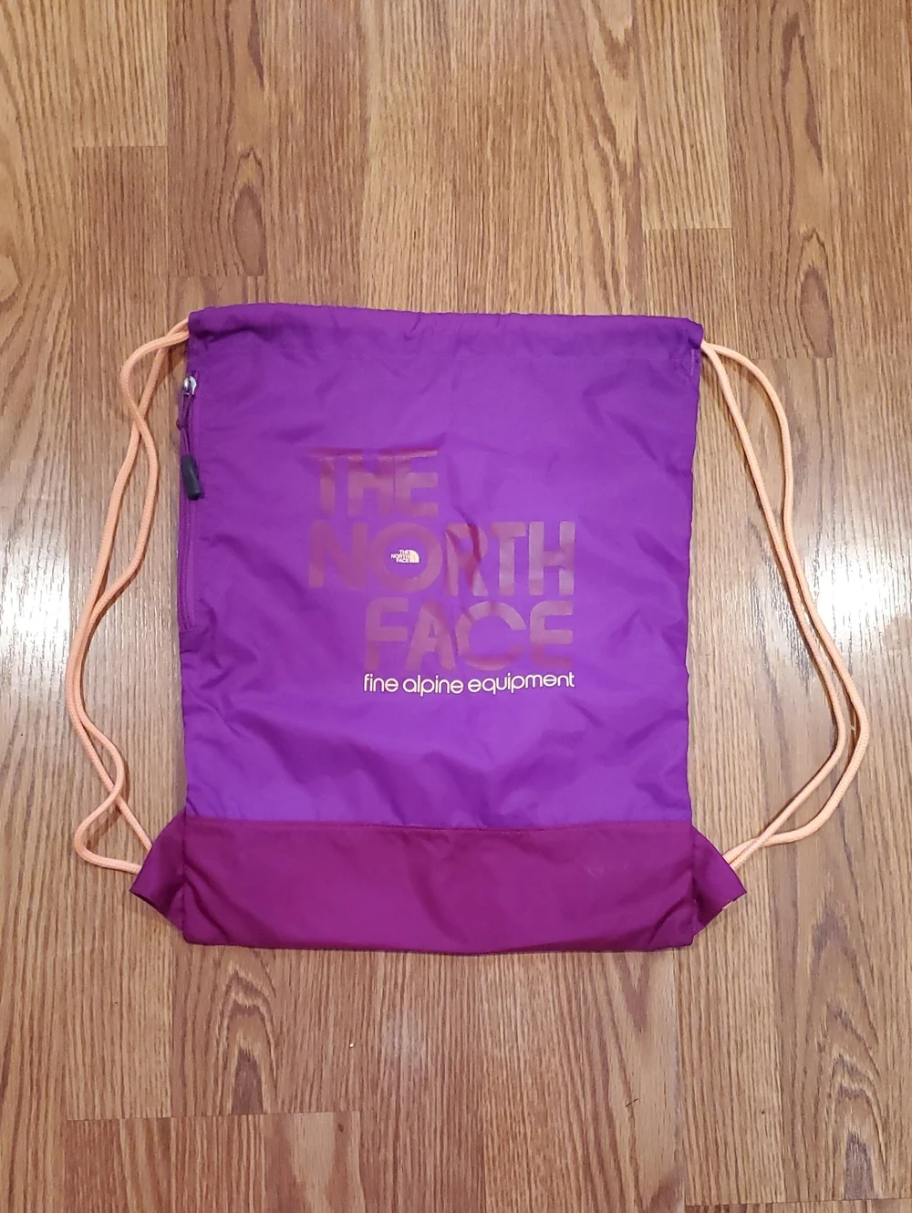 The North Face Purple Drawstring Backpack with Peach Cords With Zippered Pocket