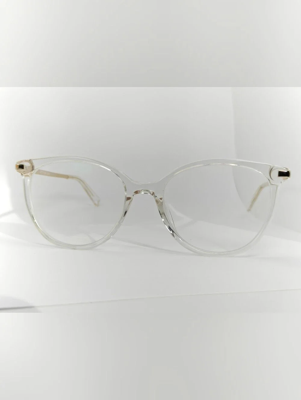 Atitude. Clear Round Frame Gold Temples. Women's Glasses - Transparent