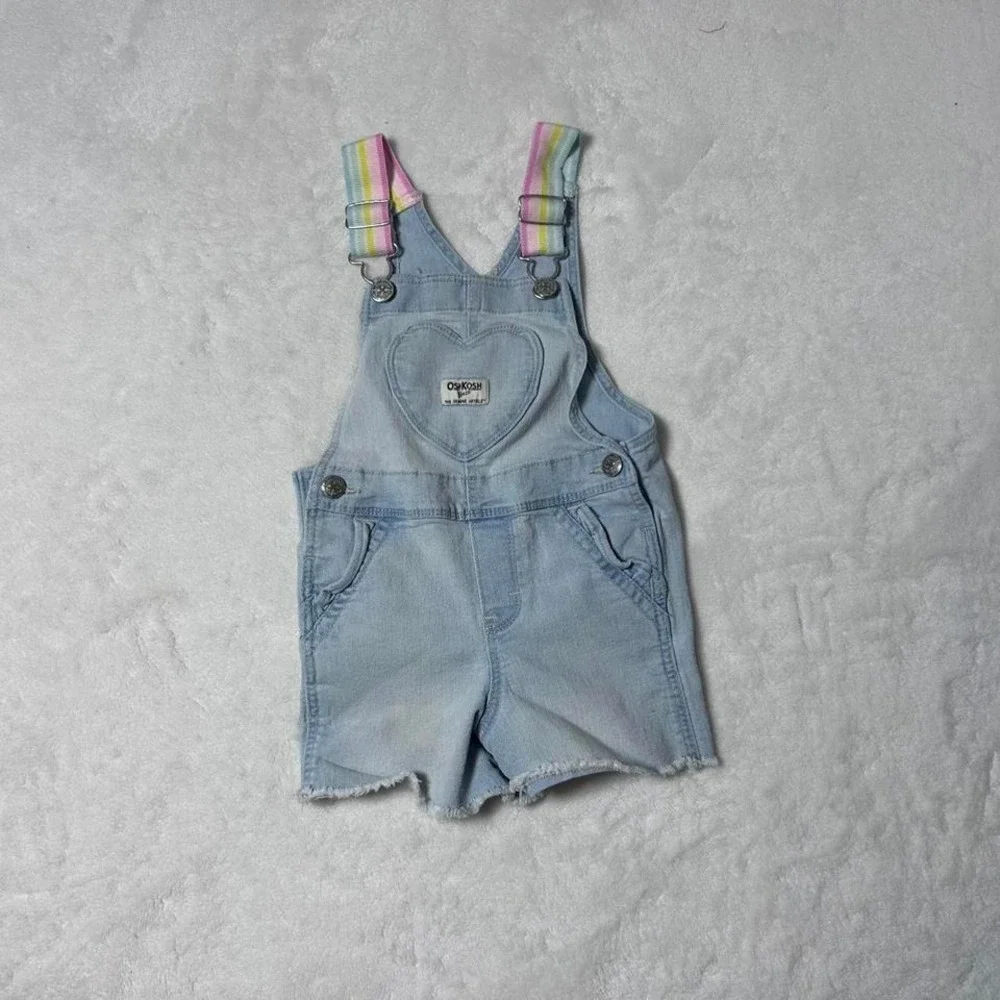Blue denim shorts overalls‎ with heart detail and rainbow straps. Size: 2 years