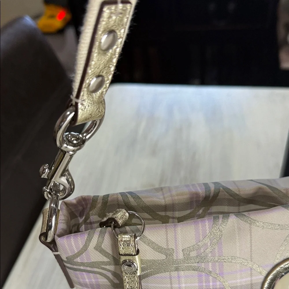 Coach features plaid bag