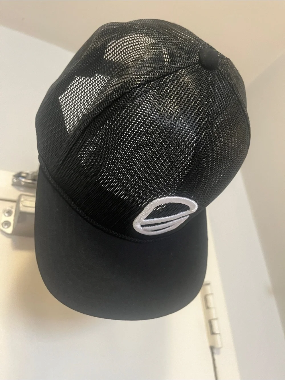 Extracurricular Black Mesh Trucker Cap with White Embroidered Logo