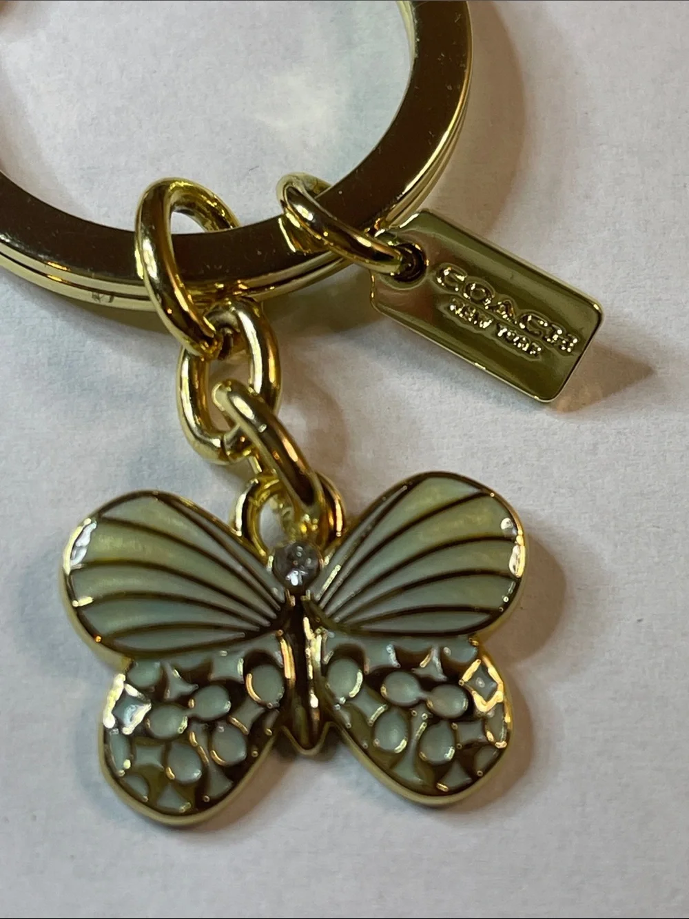 Coach Gold Butterfly Key Ring with Green Enamel Charm and Coach Pen