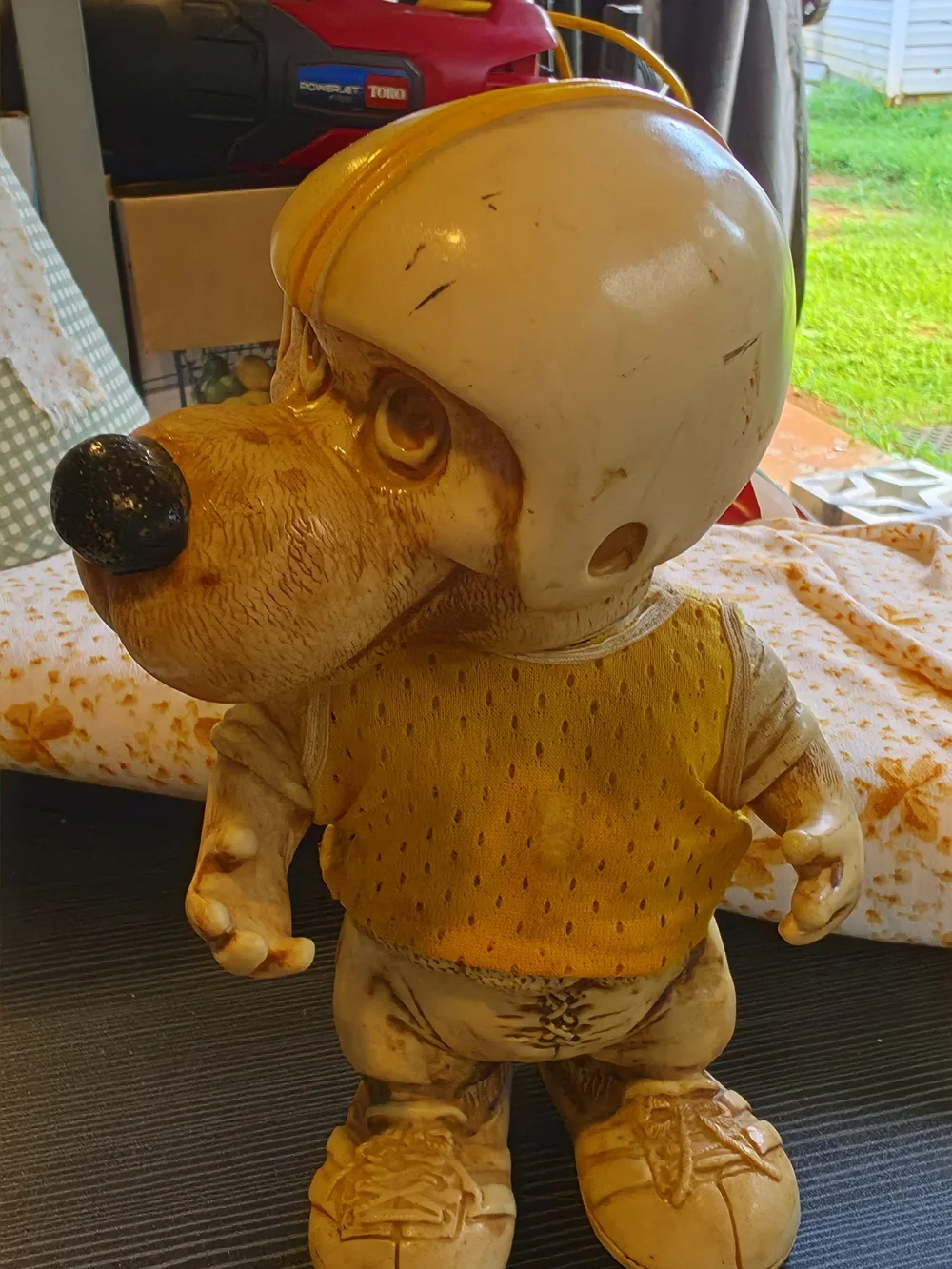 Vintage Dog Figurine Wearing Helmet - Yellow Accent