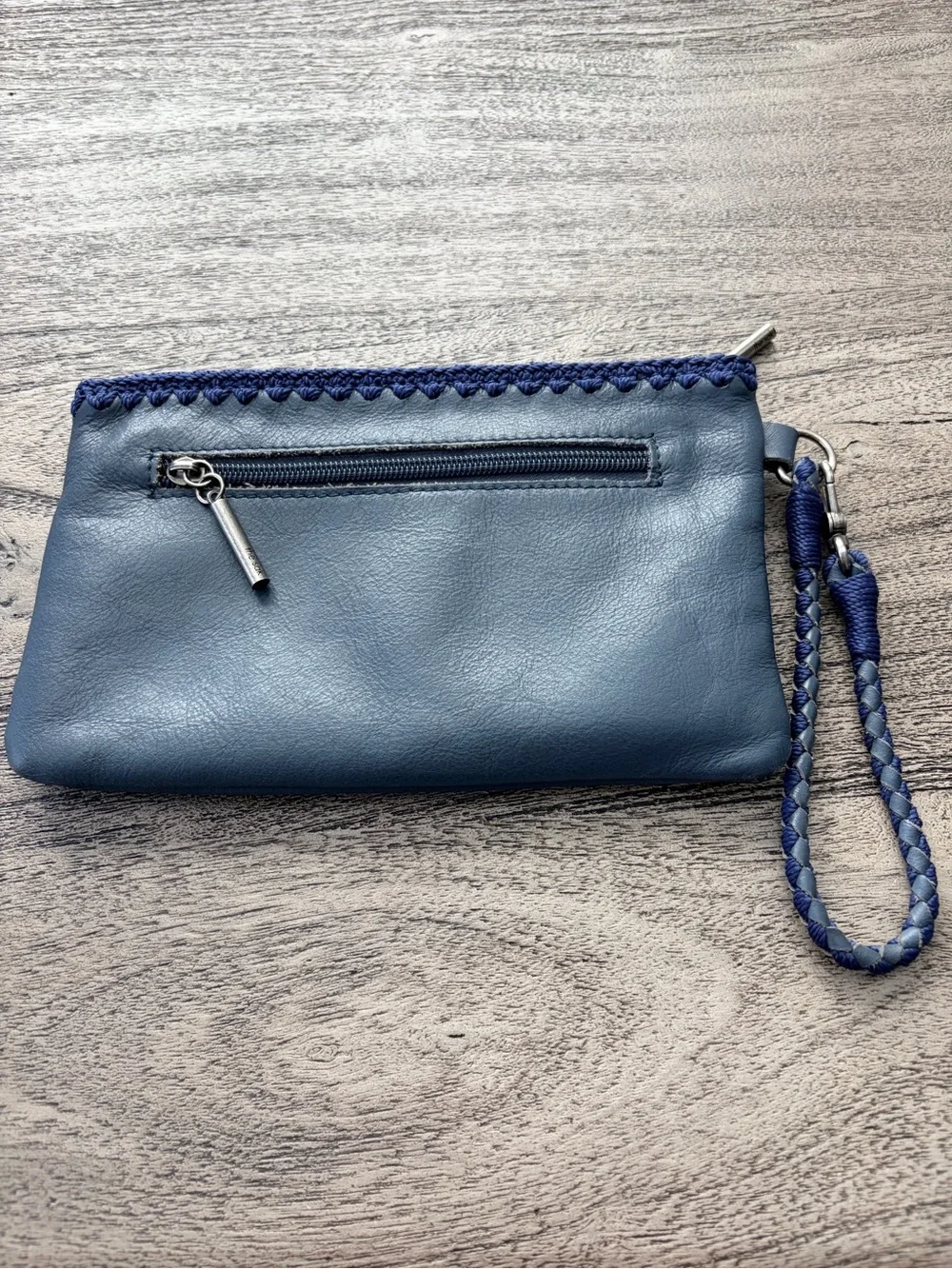 The Sak Vita Blue Leather Boho Wristlet with Crochet Trim EUC