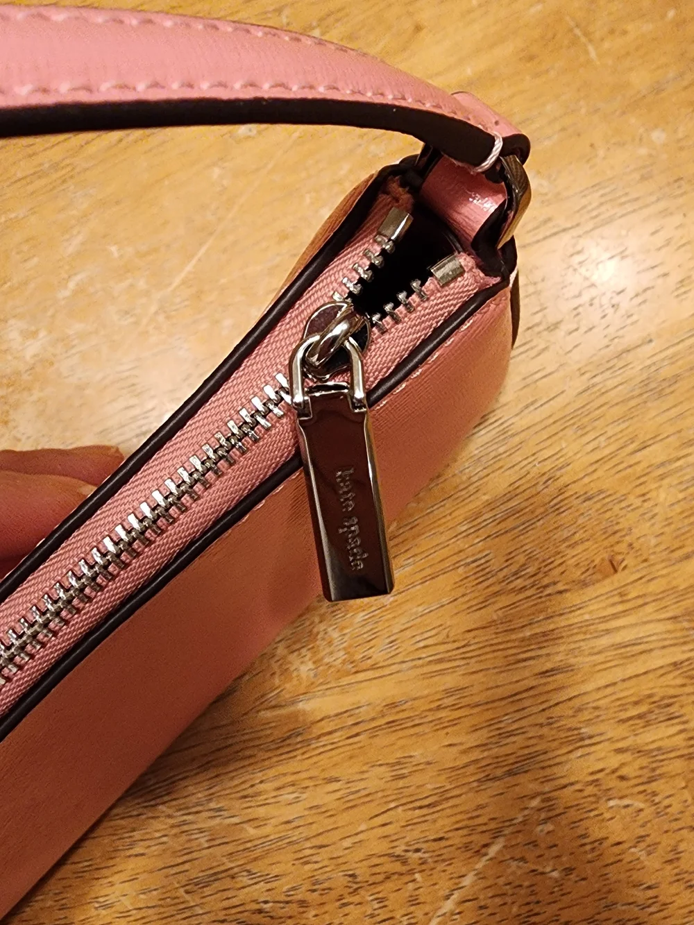 Kate Spade New York Gemini Convertible Wristlet in a pink color