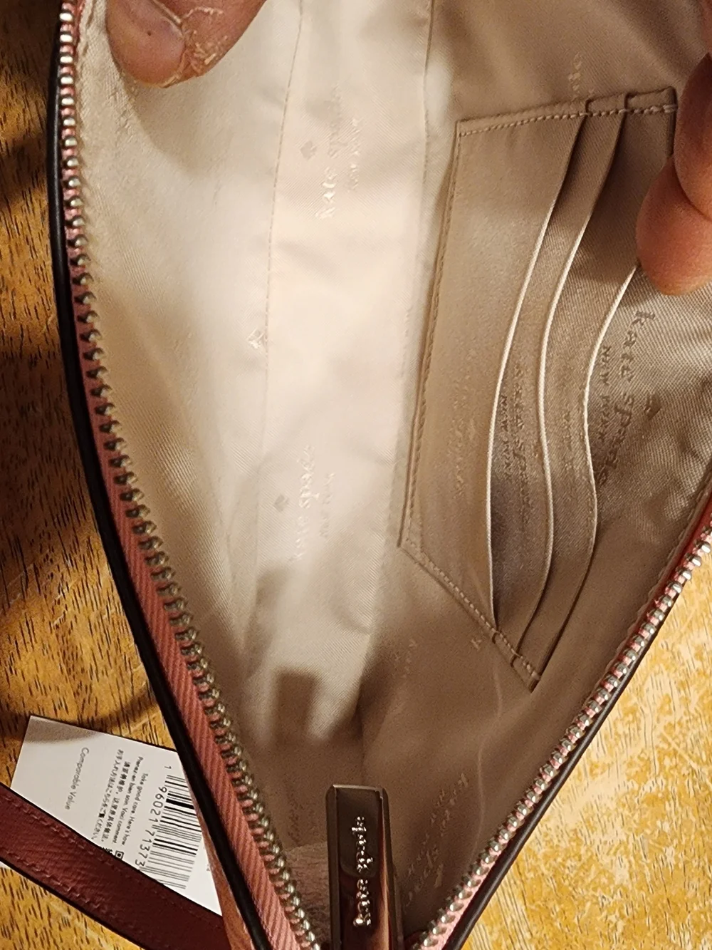 Kate Spade New York Gemini Convertible Wristlet in a pink color
