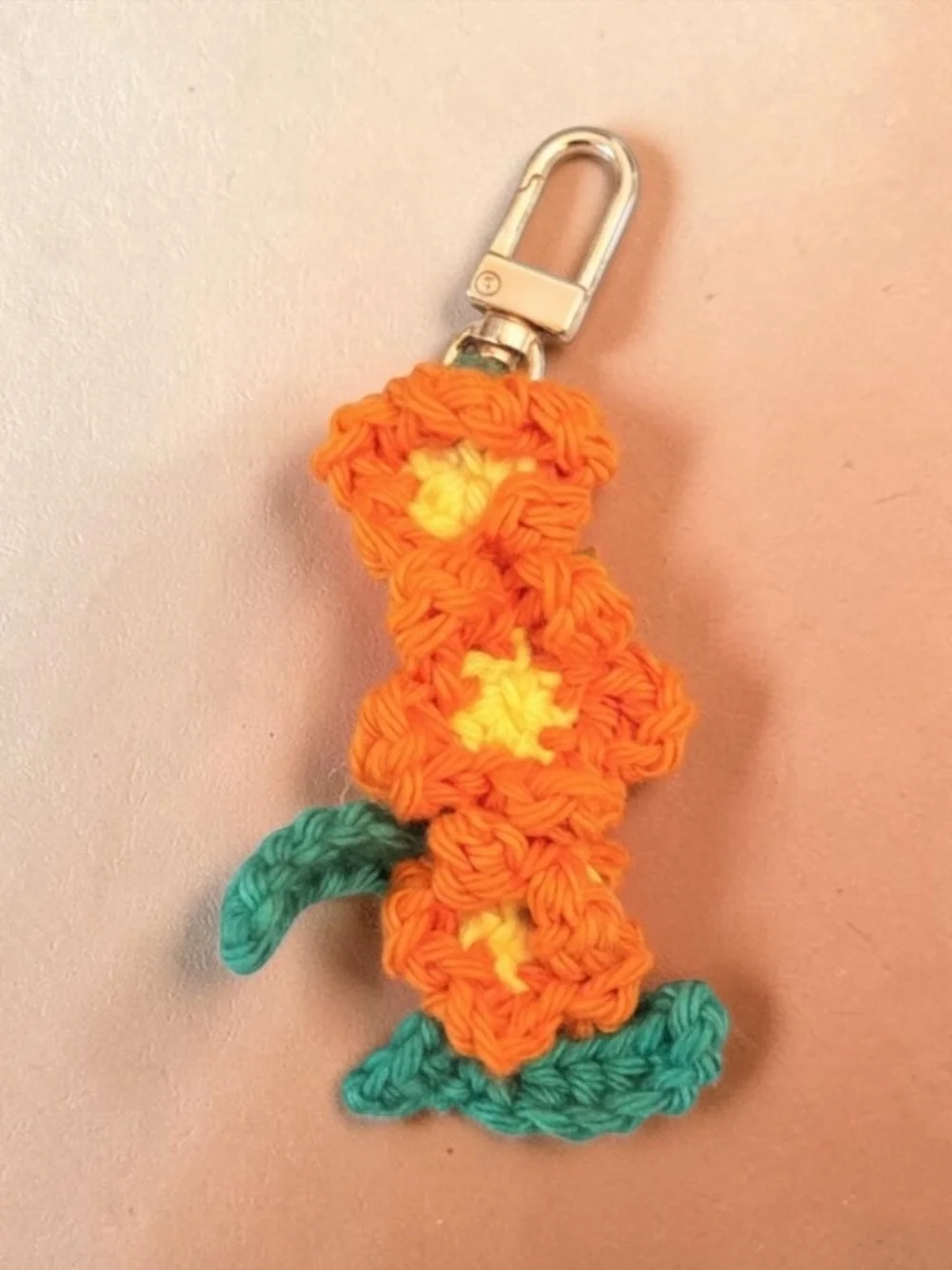 Handmade Orange Crochet Flower Keychain with Teal Leaves