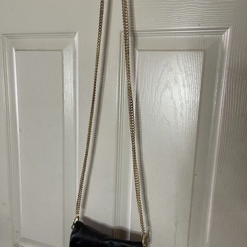 Paradox leather black small crossbody bag with ajustable gold tone chain.