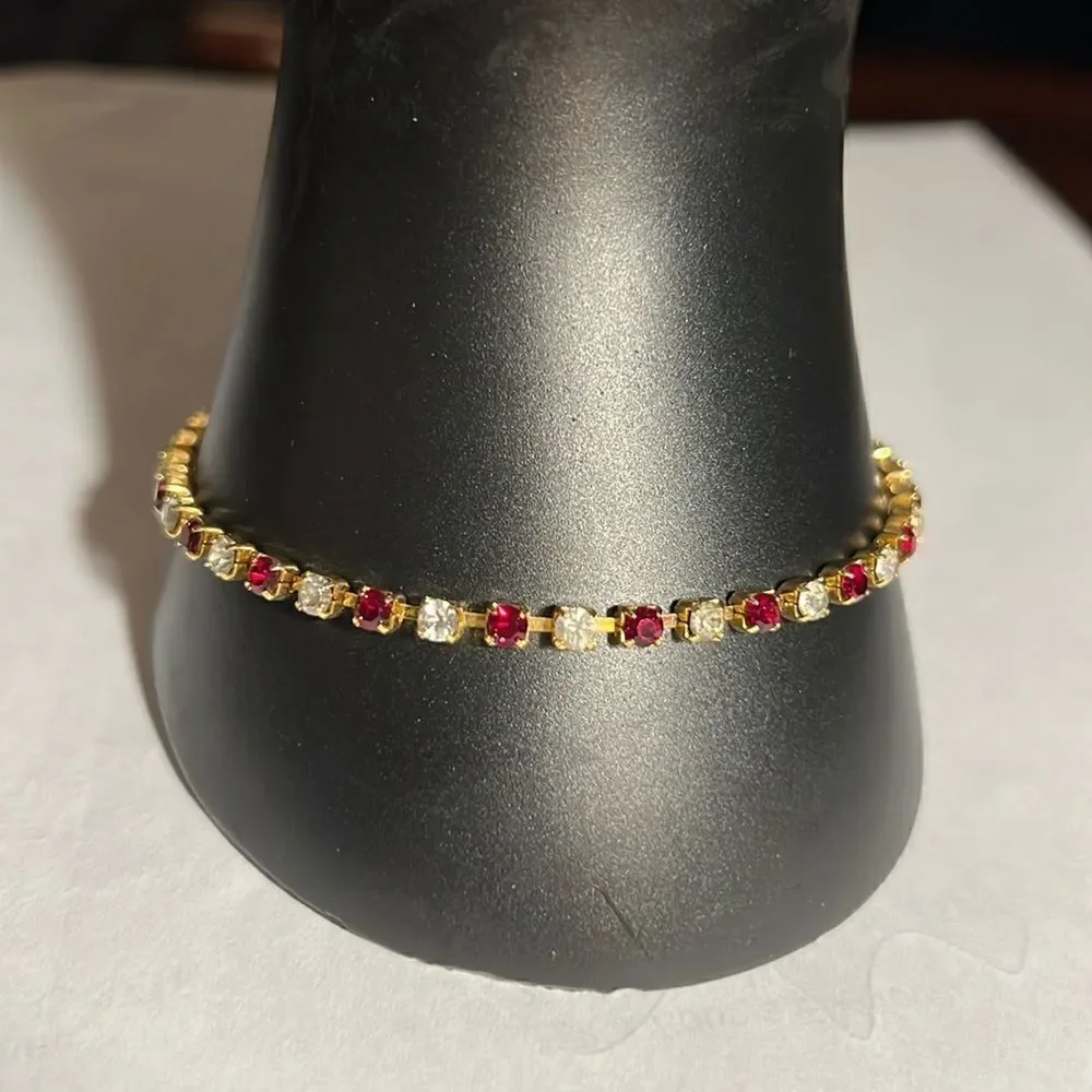 Ladies 8” faux Ruby/Diamond tennis bracelet.