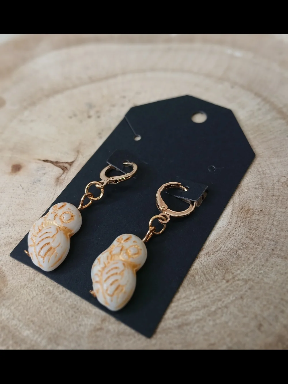 Gold Hoop Earrings with Cream Carved Bead Charms