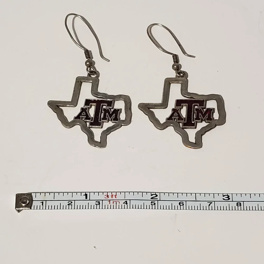 Source Unknown dangle tamu