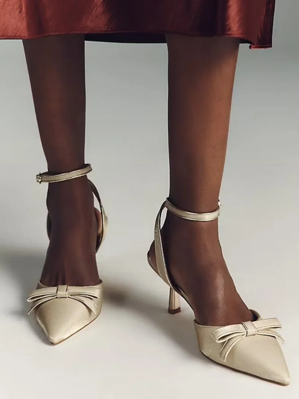 Anthropologie Maeve Pointed-Toe Ankle-Strap Bow Heels size 7 gold satin new