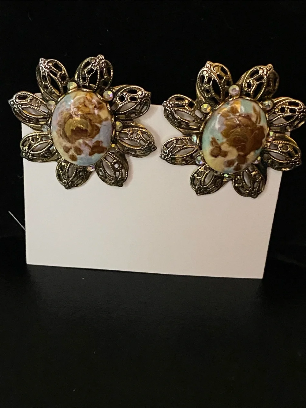 Gold-Tone Floral Filigree Clip Earrings with Brown Resin Center