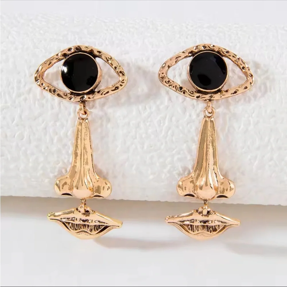 Gold and Black Eye Earrings Face