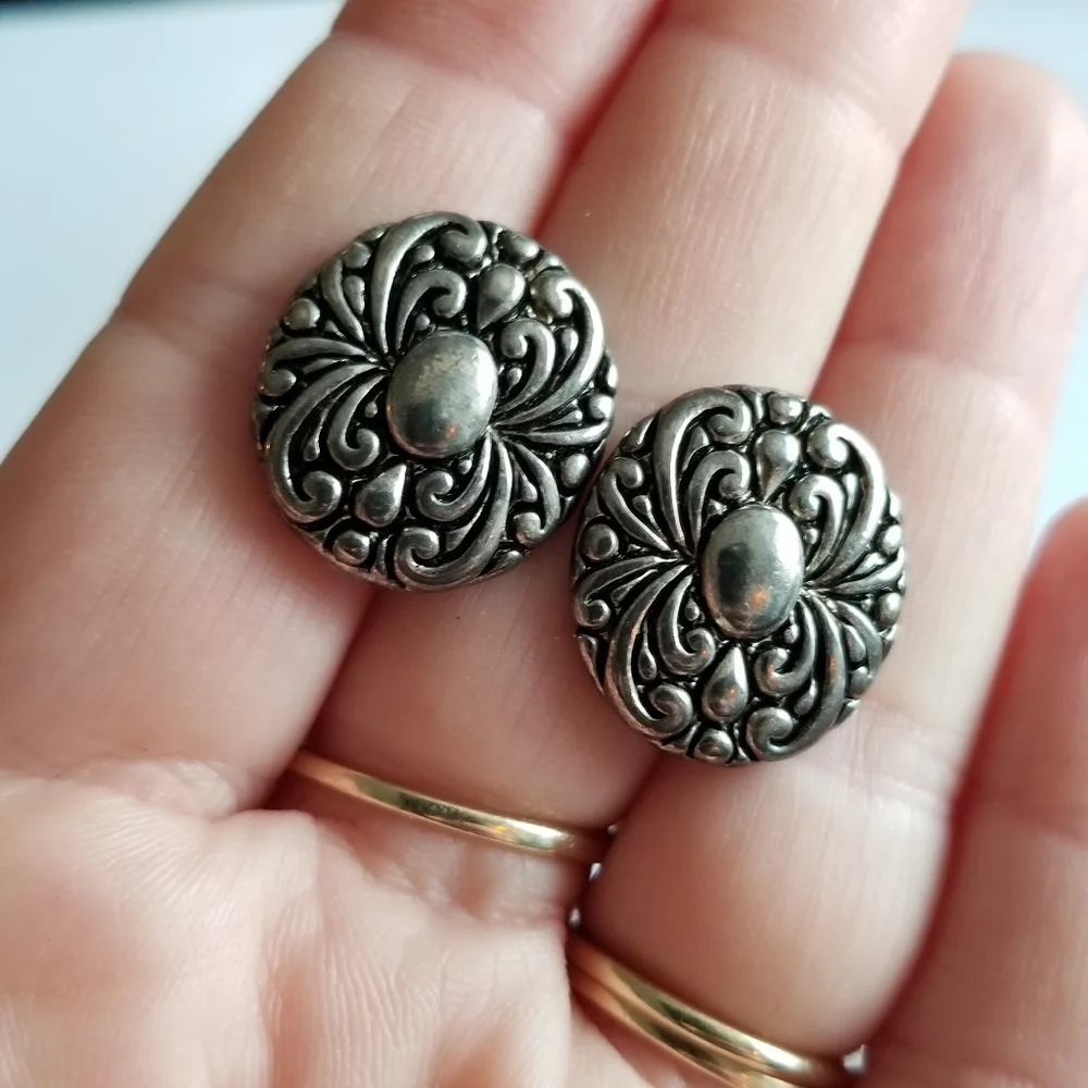 Earrings Silver tone earrings oval stud scrolled design