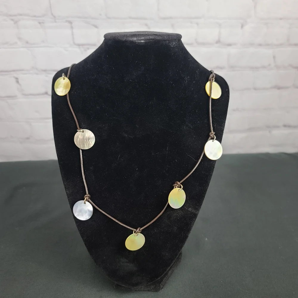 American Eagle Outfitters Necklace: leather and Mother of Pearl Disks.