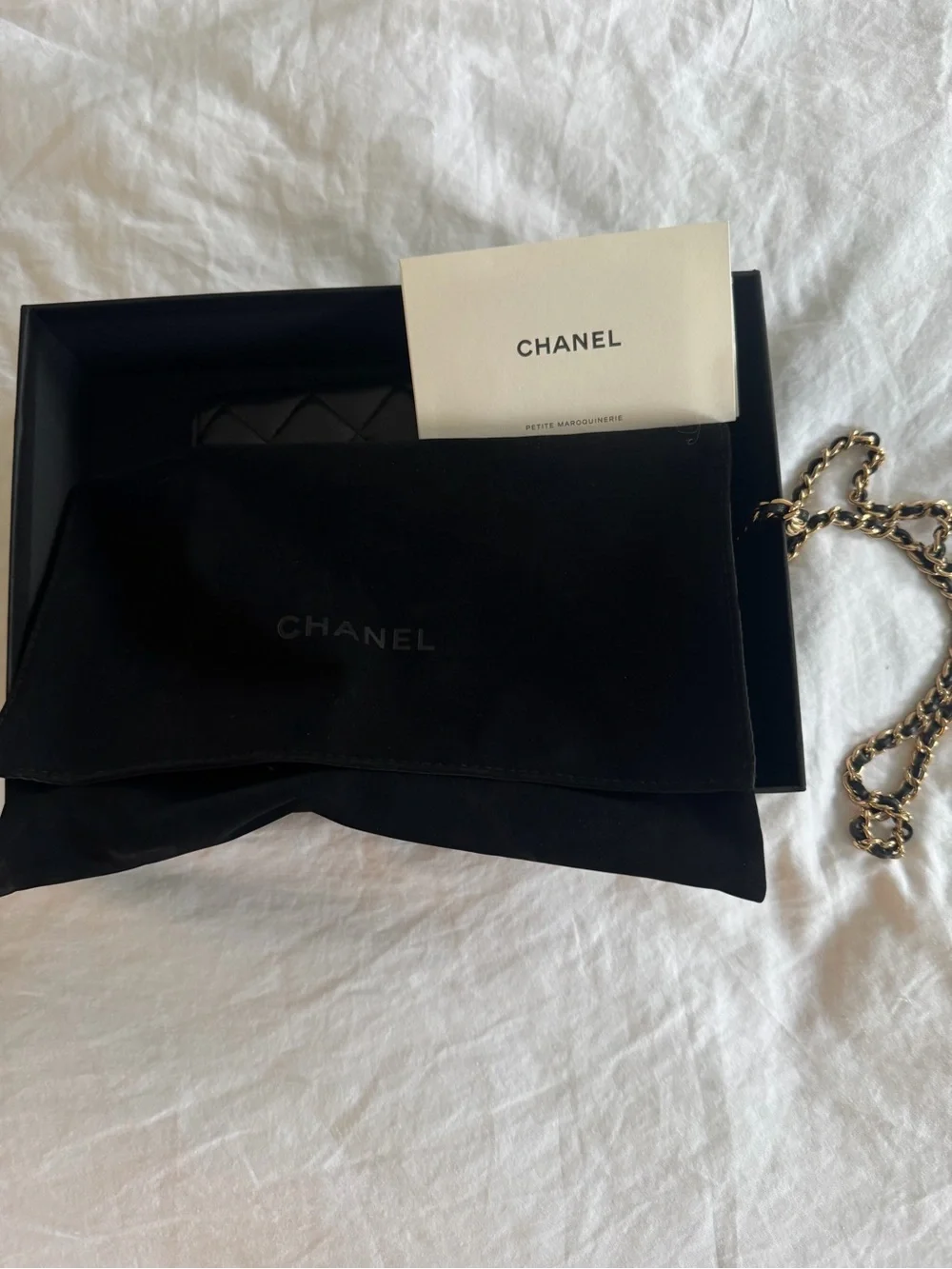 CHANEL Black Leather Wallet with Gold Chain Accent