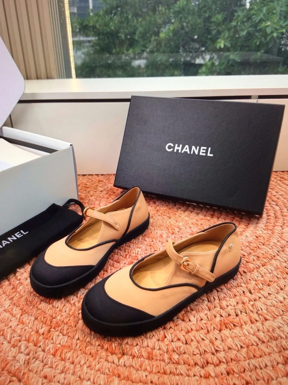 CHANEL Beige and Black Mary Jane Flats with Gold Buckle