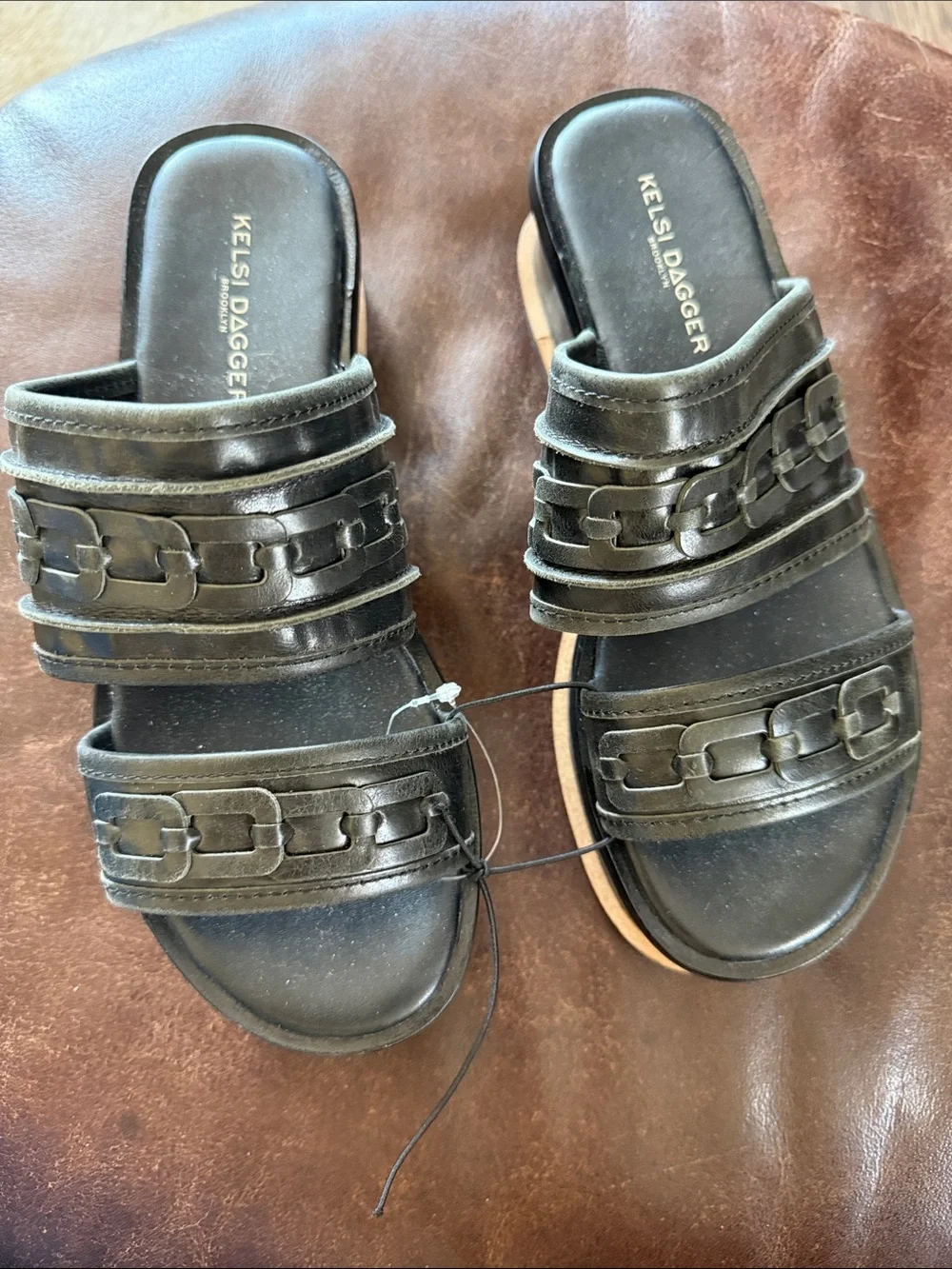 Kelsi Dagger Brooklyn Drift platform slide sandals in black leather featuring 7