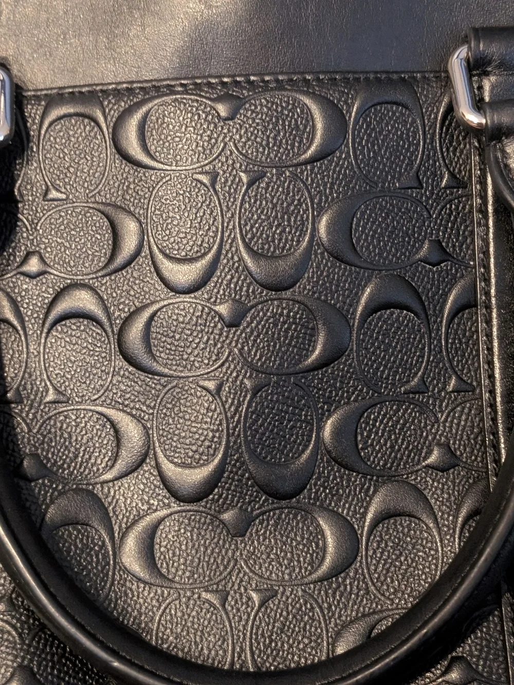 Coach sleek black
