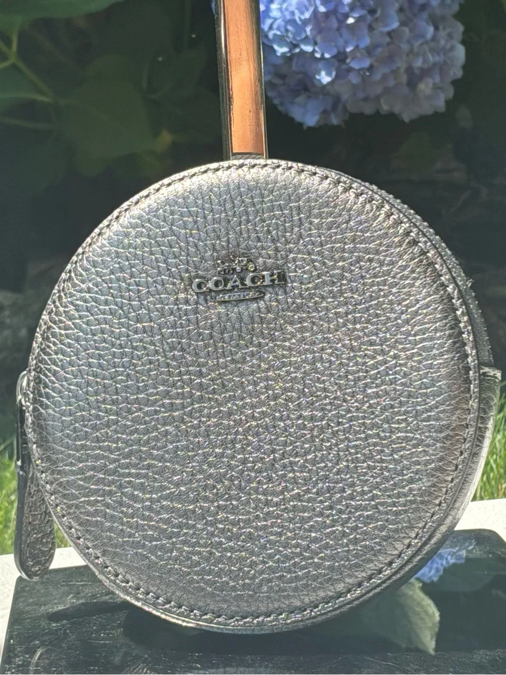 COACH Metallic Silver Gray Round case.