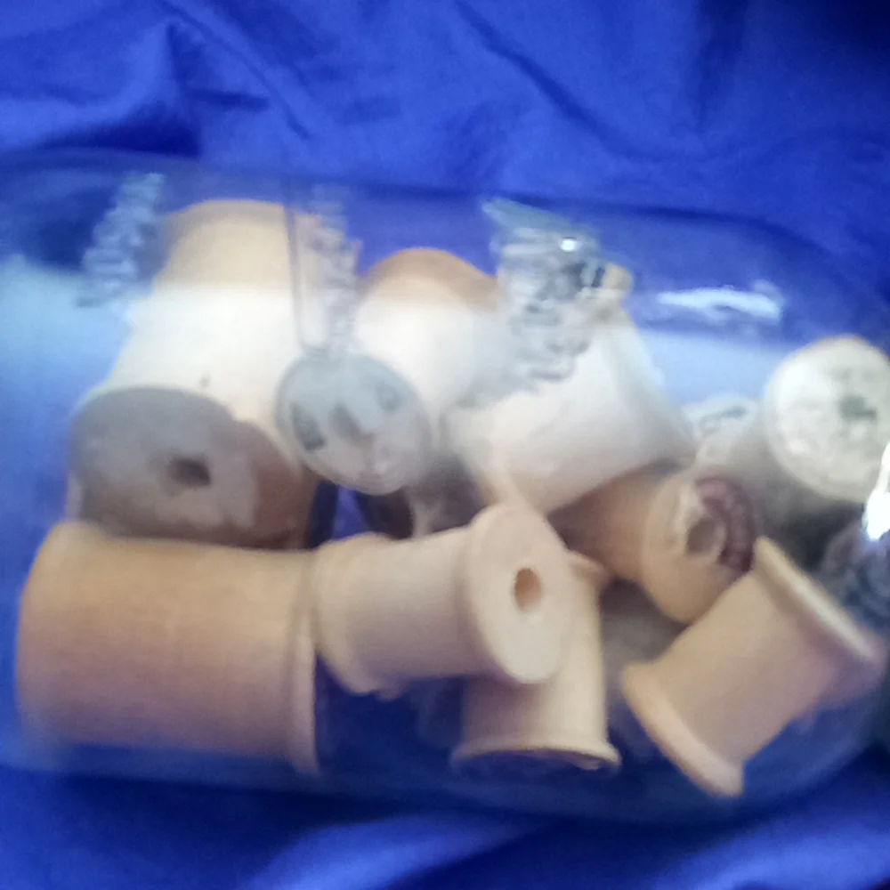 Vintage kerr Mason jar with 25 vintage wooden thread spools