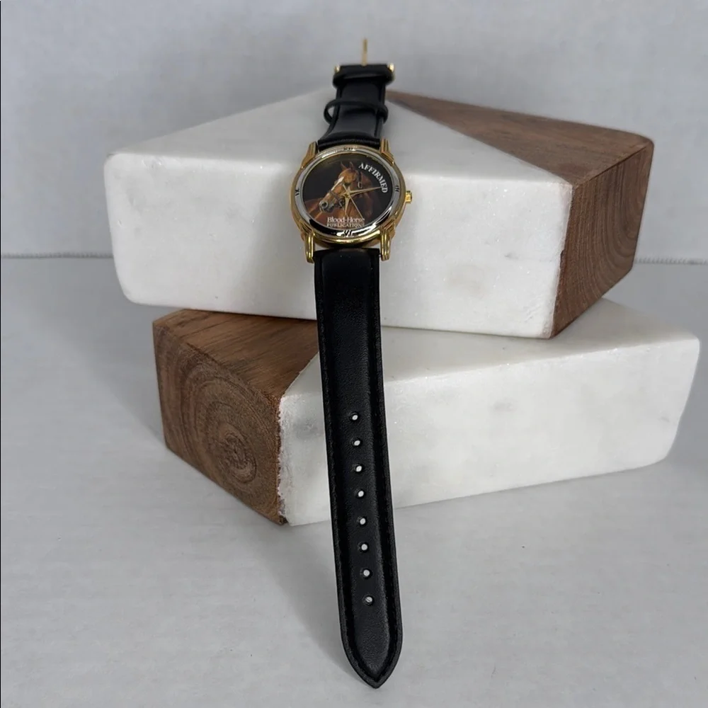 Vintage Affirmed Black and Gold Watch with Horse Design lot W2