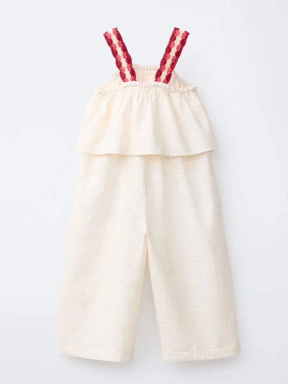100% cotton jumpsuit with crochet pocket and straps
