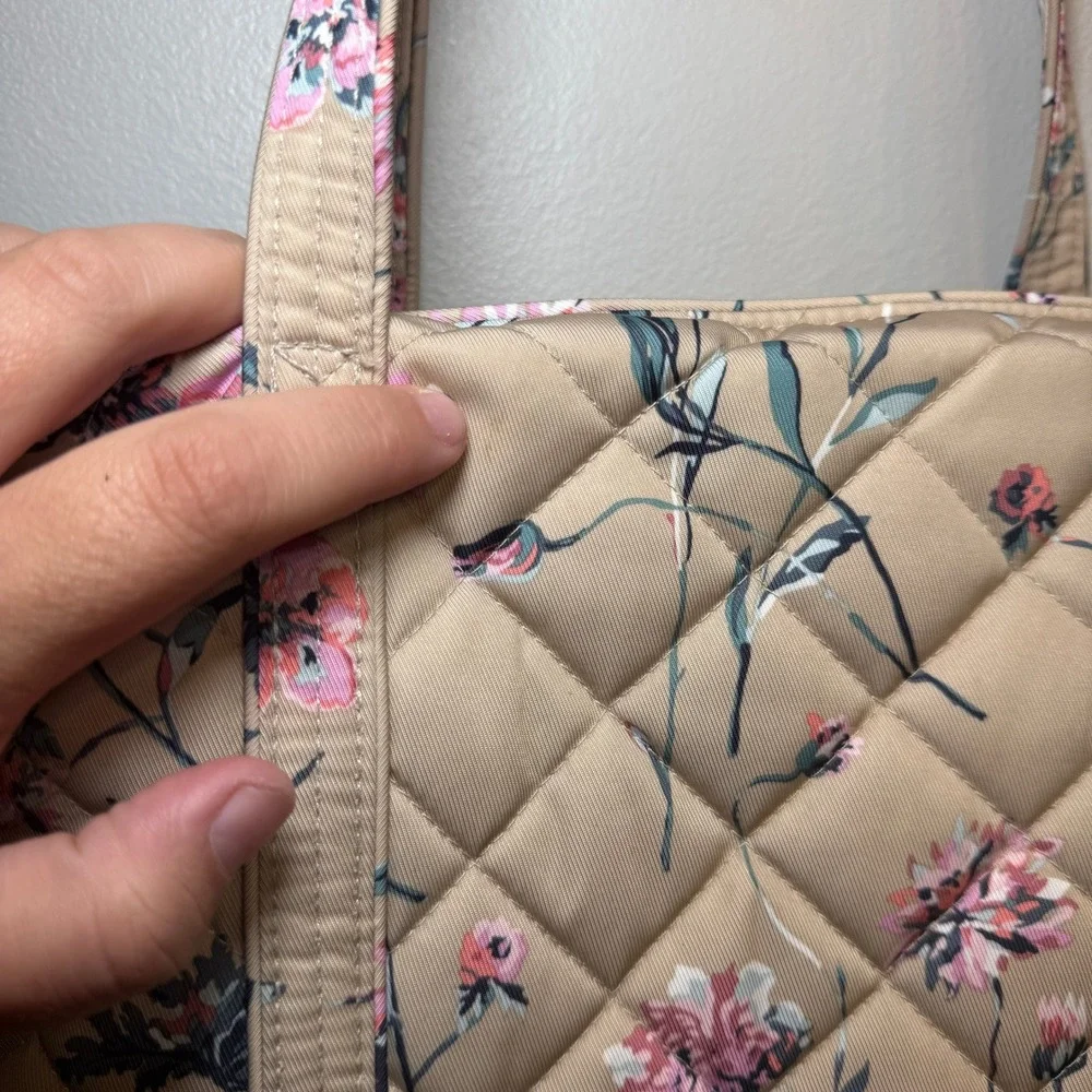 Vera Bradley closure accents sophisticated