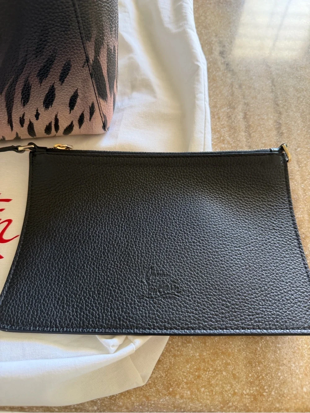 Christian Louboutin strap handles includes