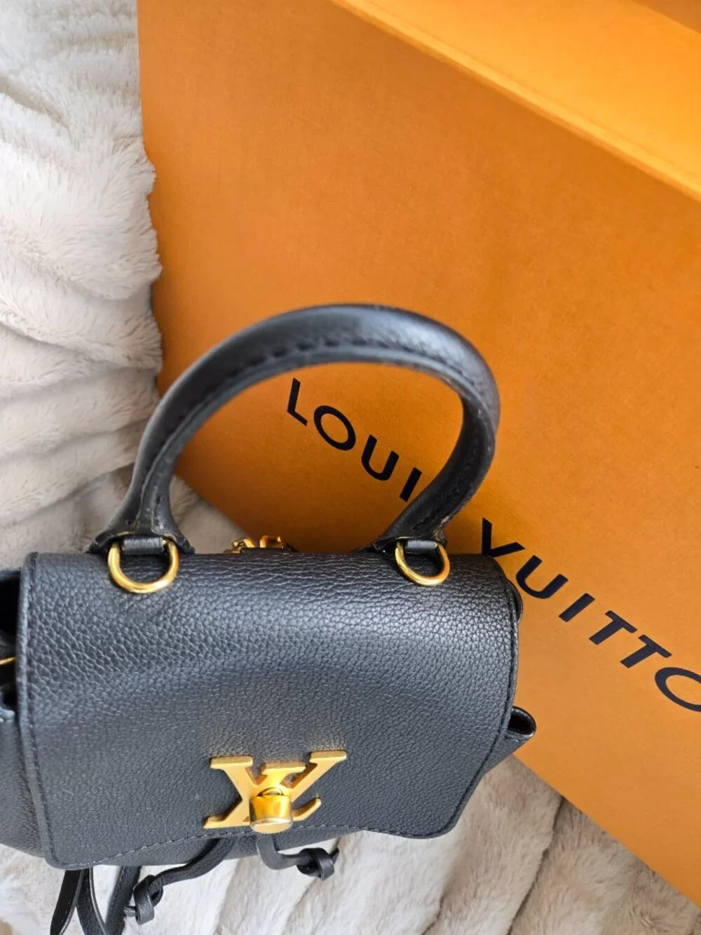Louis Vuitton Lock Me Mini Backpack