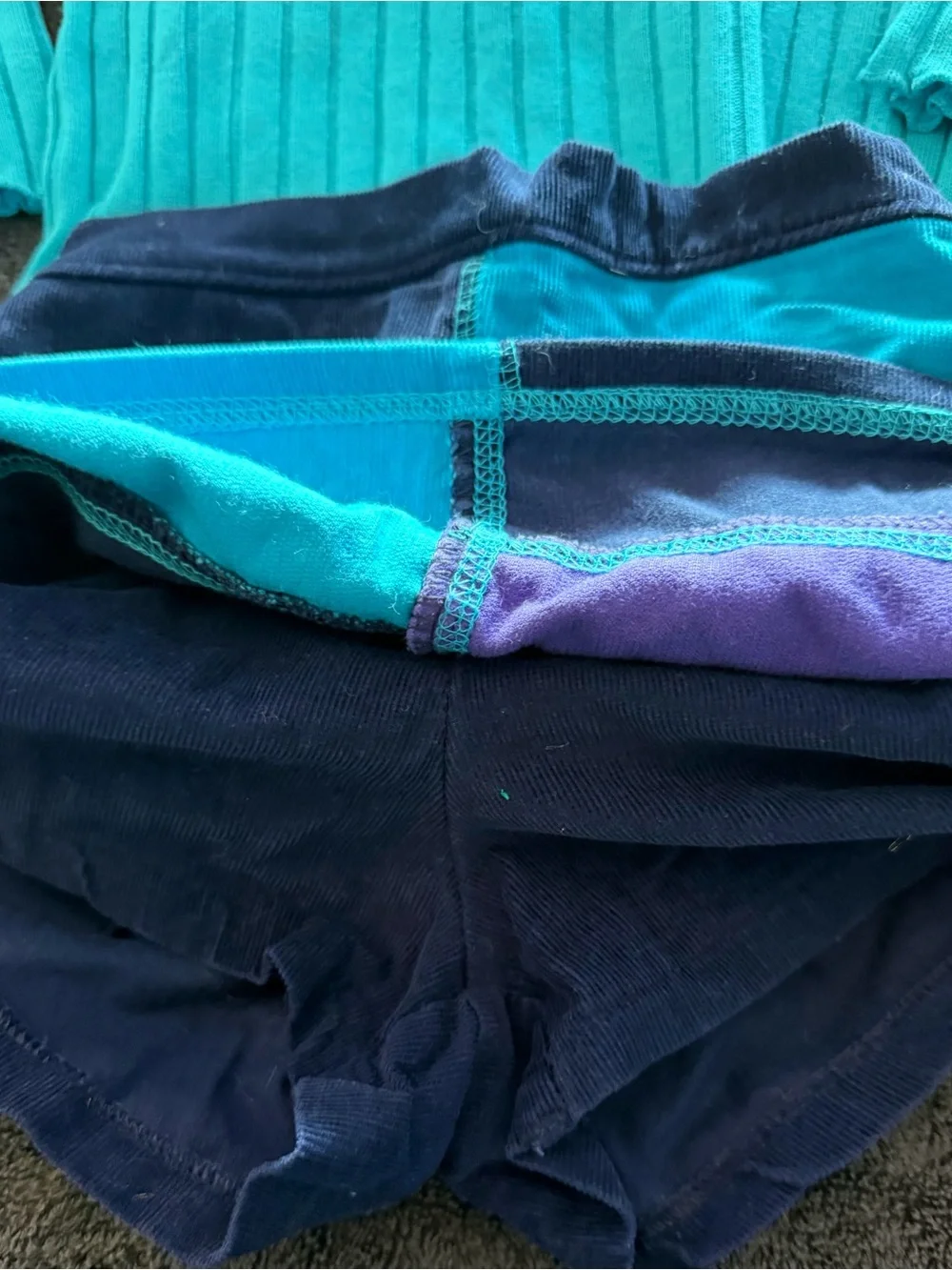Child’s Turquoise Knit Ruffle-Neck Top with Playful Patchwork Skort/stockings