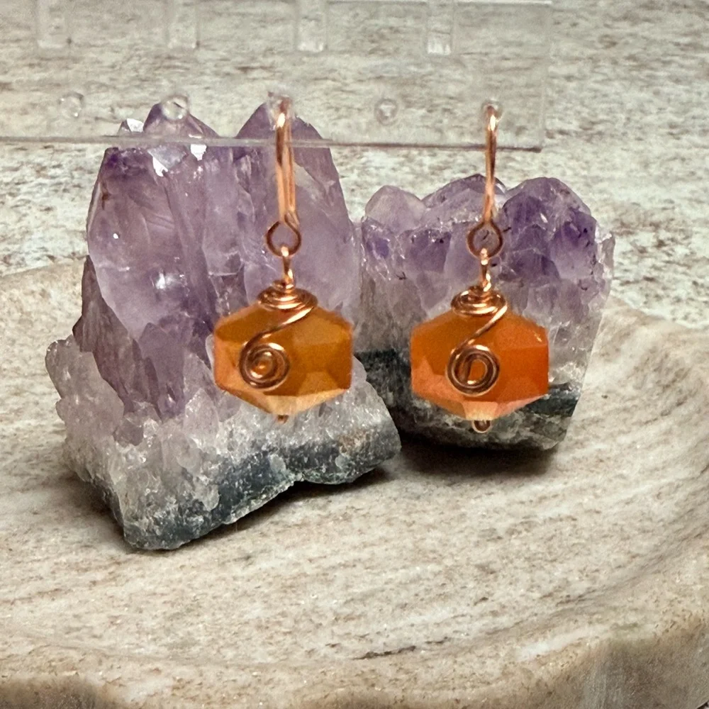 Copper Wire-Wrapped Orange Faceted Hexagon Earrings.
