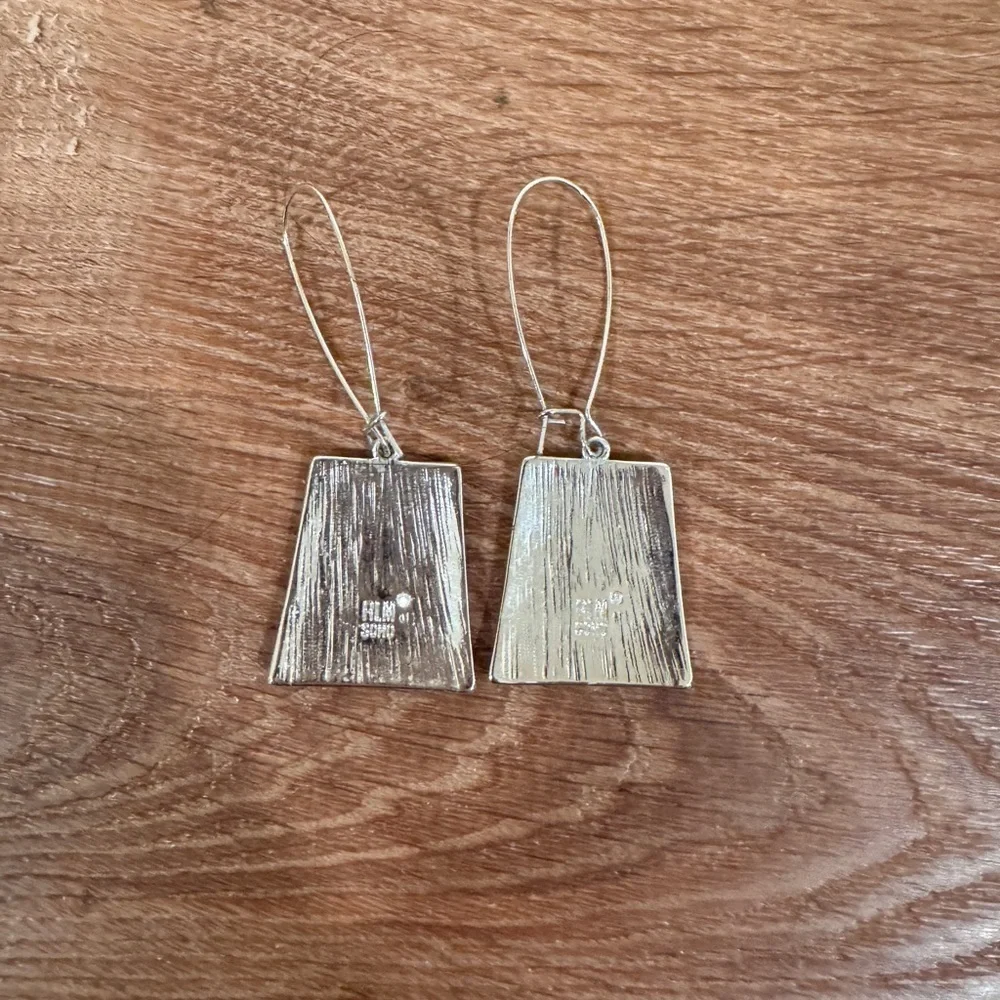 RLM Soho earrings worn lightly