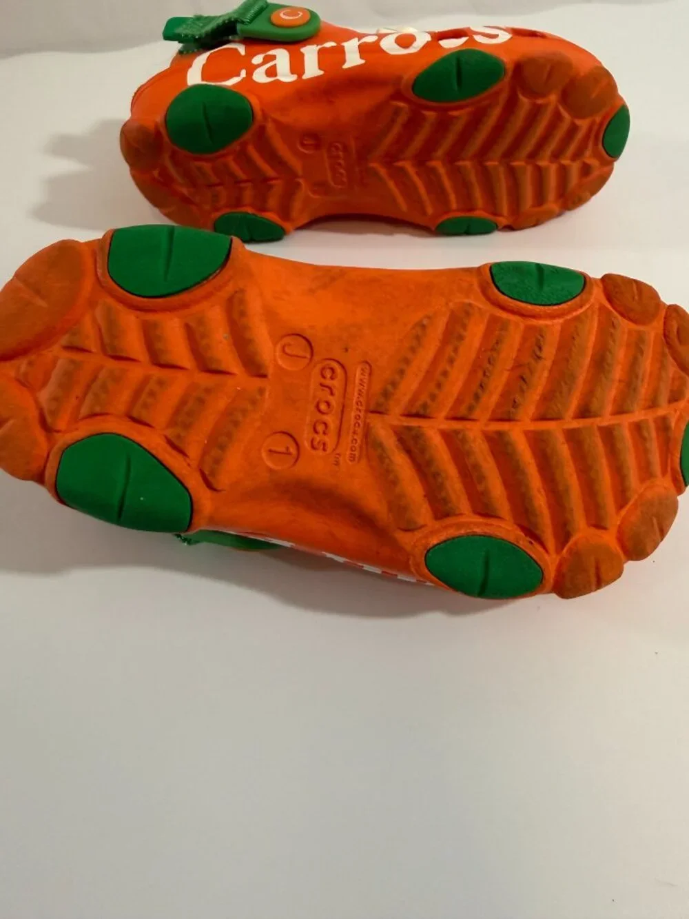 Crocs Carrots clogs with green straps & Croc charms size 1 Junior- gently used
