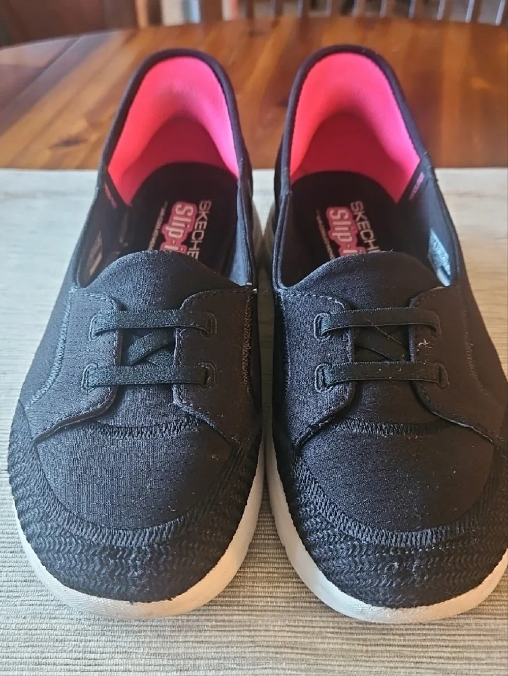 Skechers Women's Black Slip-On Sneakers with Pink Lining