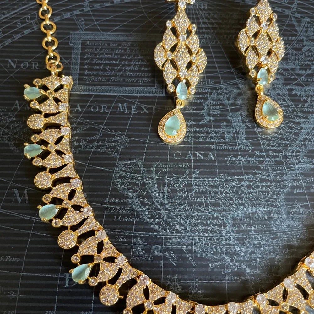 Elegant Gold-Tone Necklace & Drop Earring Set with Pale Green Gem Accents