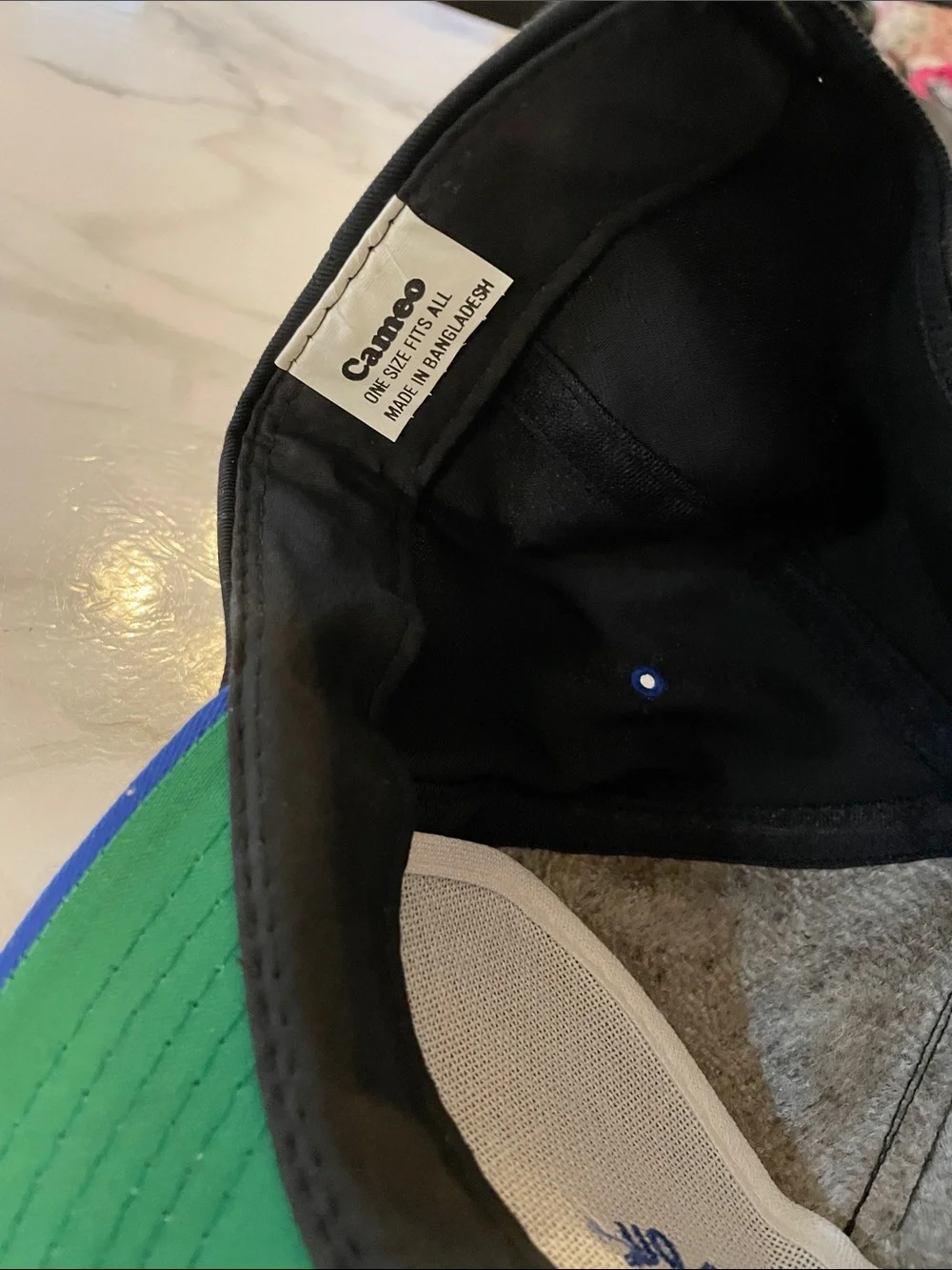 cameo Black Snapback Hat with Blue Brim and Green Underside