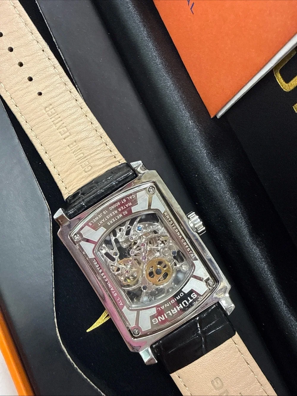 Stuhrling Original Silver Case Black Strap Skeleton Dial Watch with Gold Accents