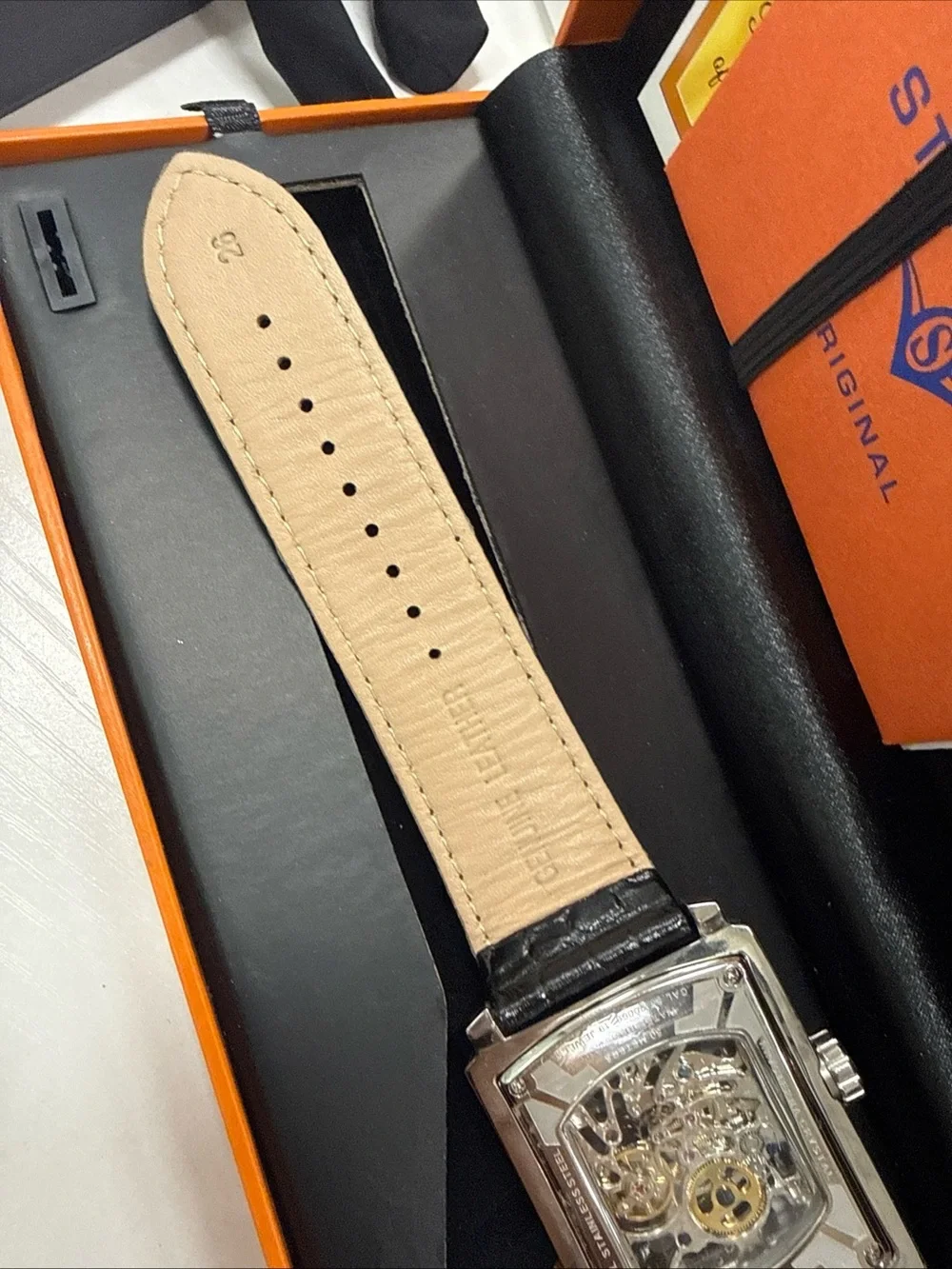 Stuhrling Original Silver Case Black Strap Skeleton Dial Watch with Gold Accents