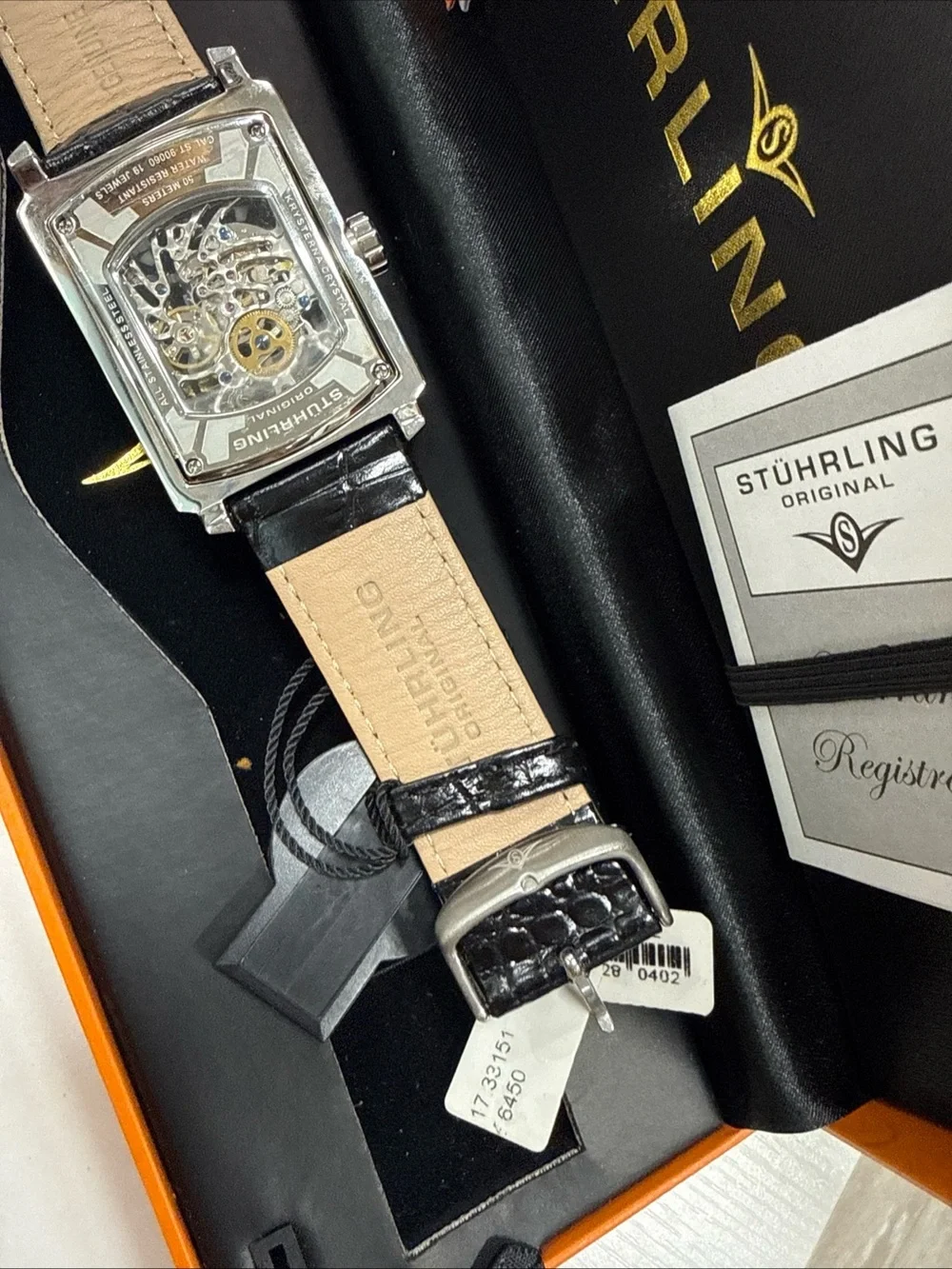 Stuhrling Original Silver Case Black Strap Skeleton Dial Watch with Gold Accents
