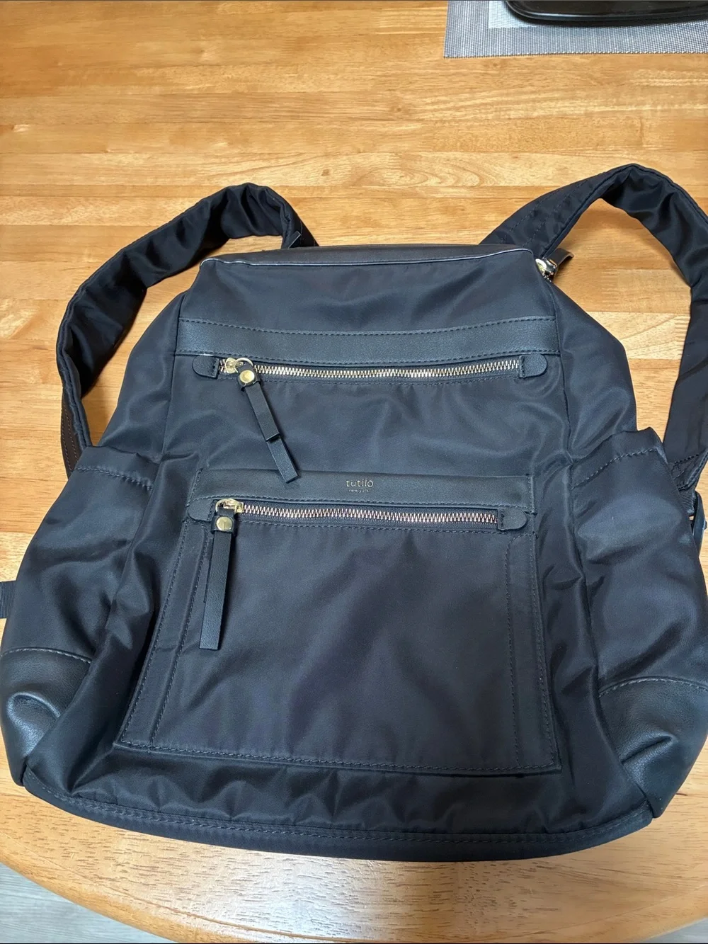 Tutilo Black Men's Backpack with Gold Zipper Accents