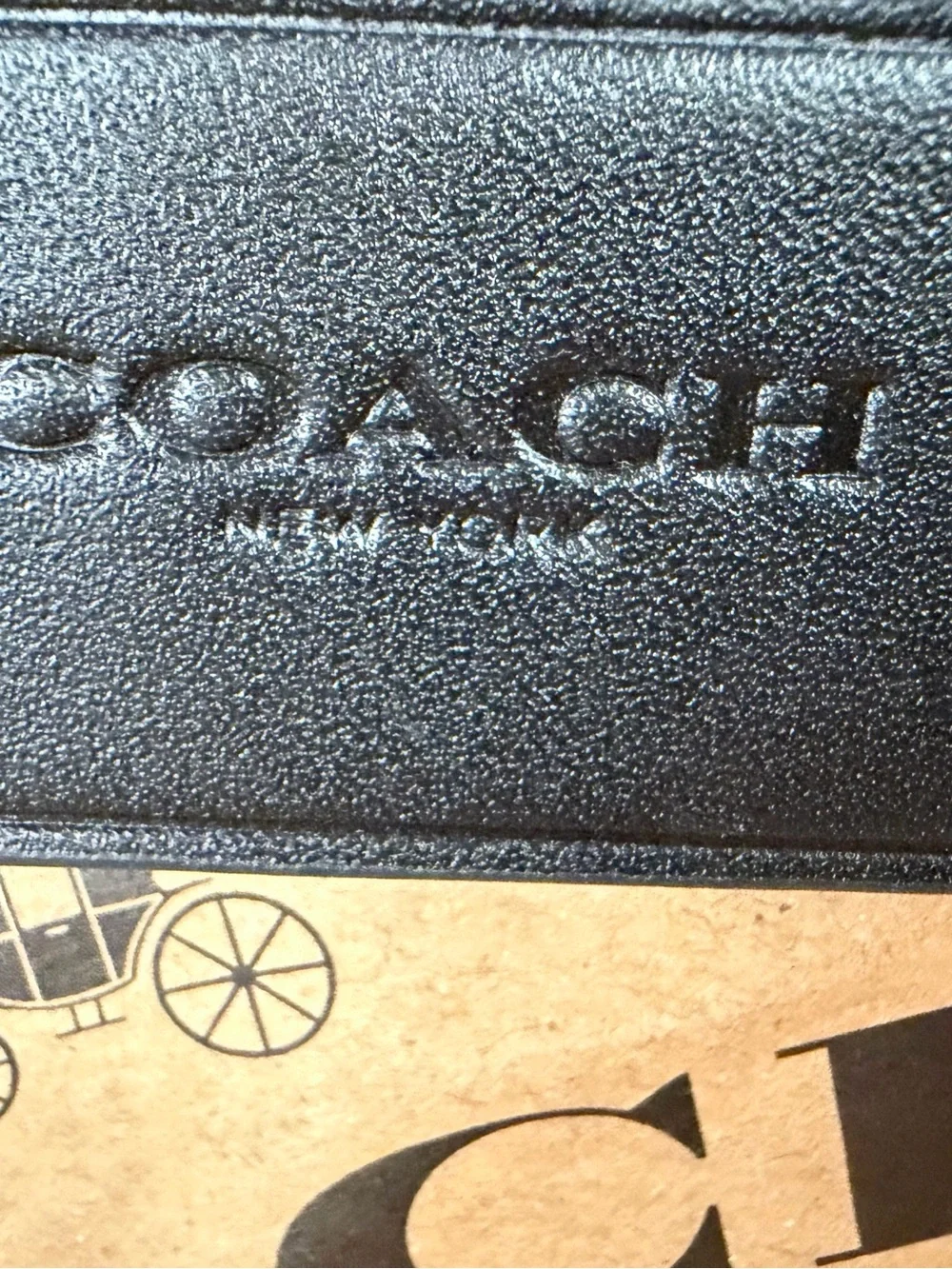 Coach textured raised