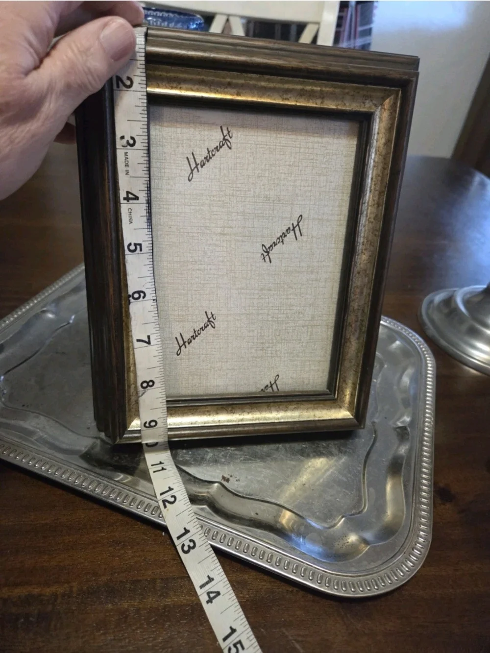 Vintage Hartcraft picture frame features a traditional brown wood finish