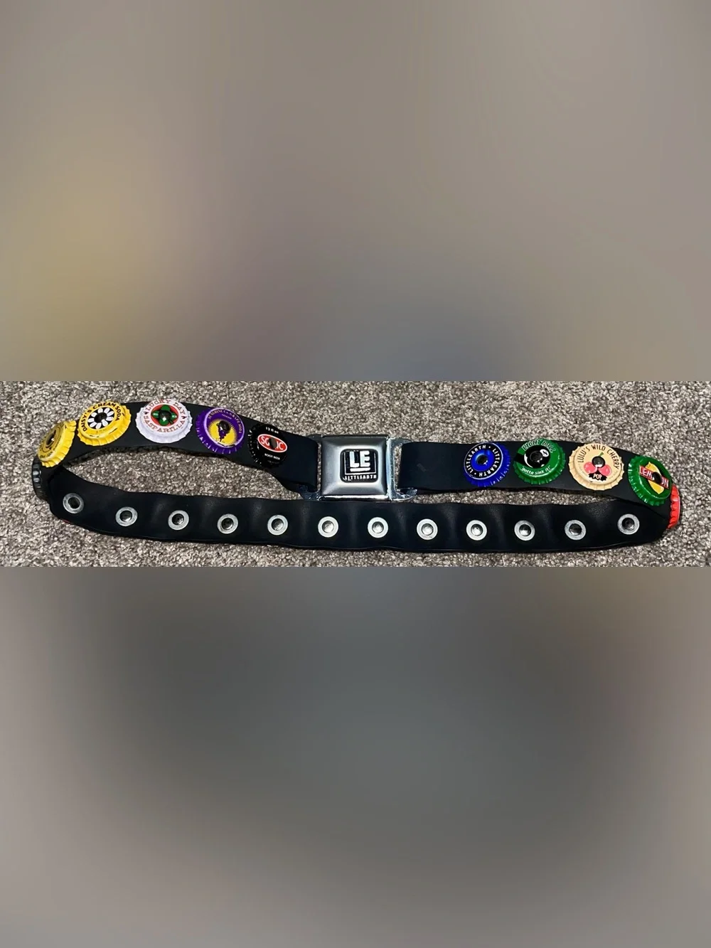 Little Earth seatbelt belt bottle caps