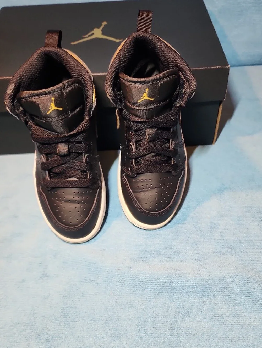 Jordan Black and Metallic Gold Mid-Top Sneakers