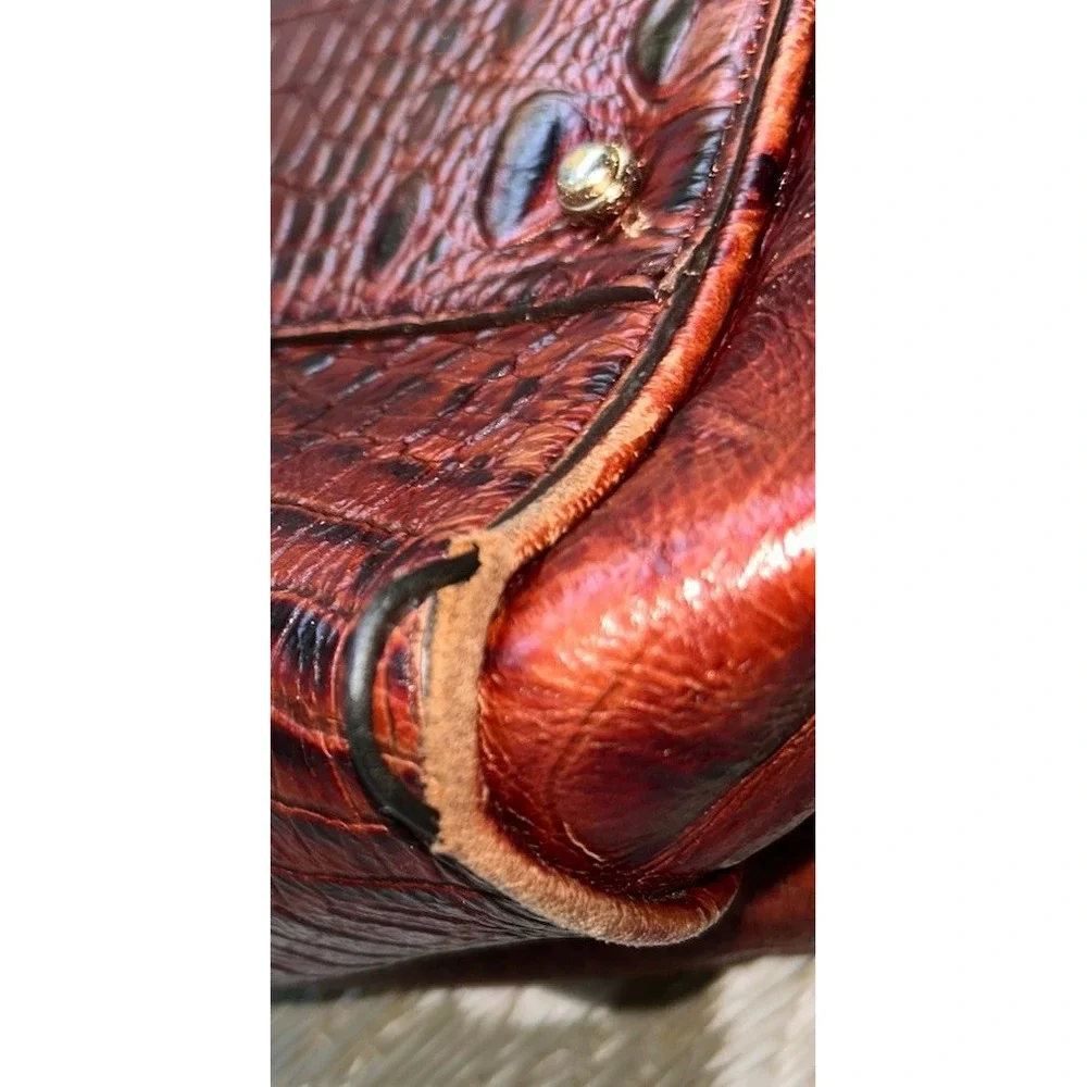 brown Brahmin bucket bag features croc-embossed leather
