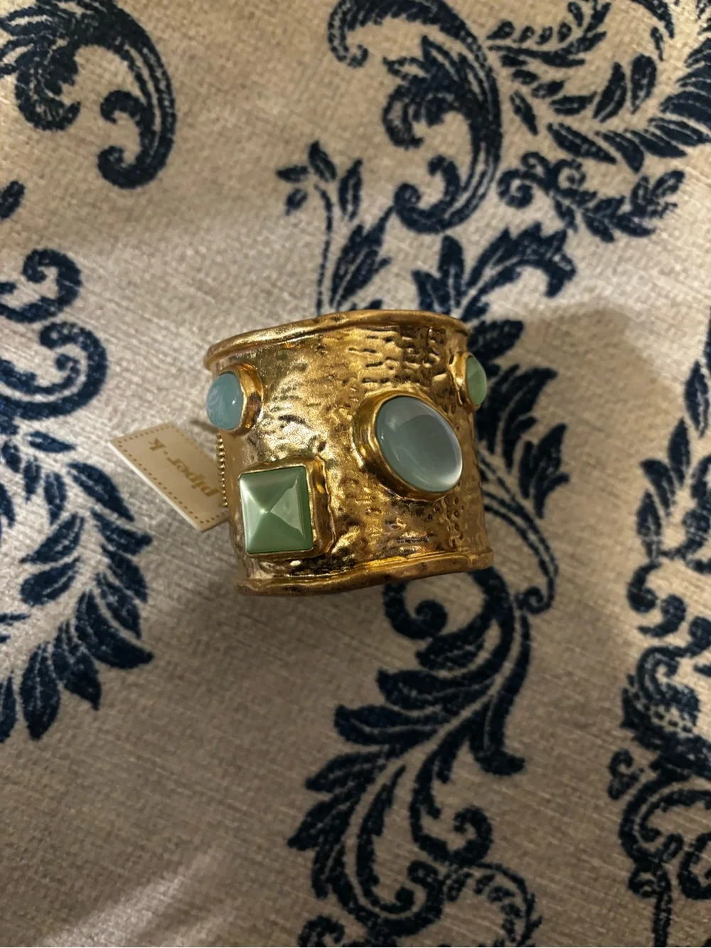 Gold Cuff Bracelet with Green Gem Accents