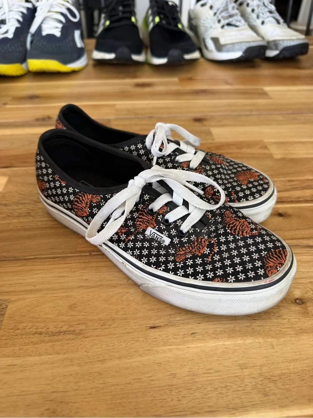 Black womens Lace-Up Canvas Vans with Orange Tiger Print