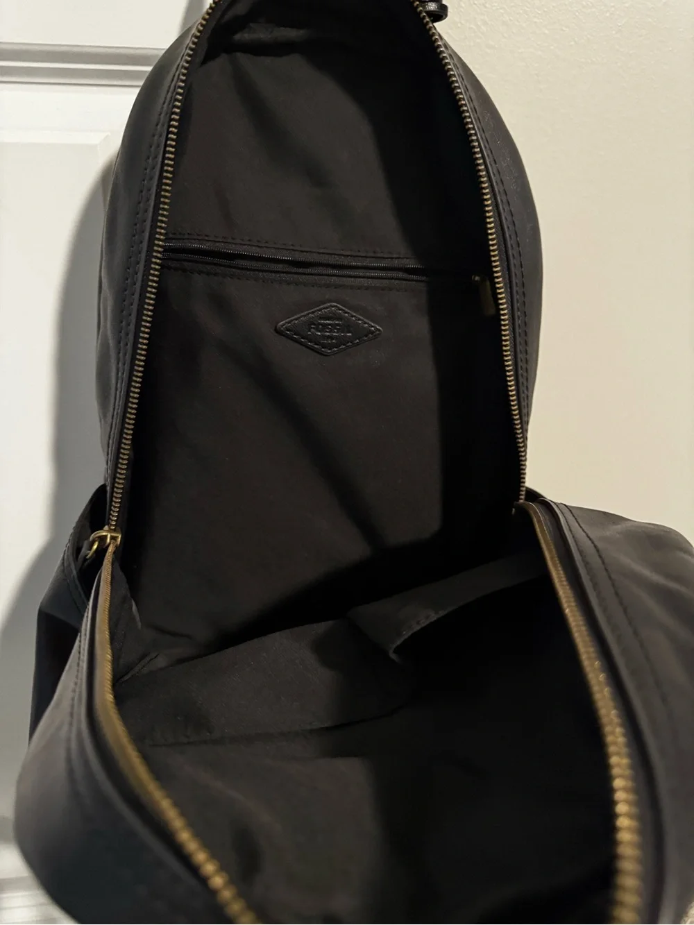 Fossil Black Leather Backpack with Gold Zip Accent